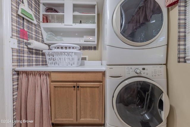 3085 Centerview Rough River Ln, Hudson, KY 40145 - laundry room featuring estacked washer and dryer and cabinet space