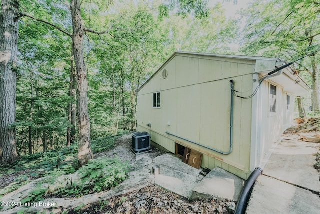 3085 Centerview Rough River Ln, Hudson, KY 40145 - view of side of property with a central air condition unit and a view of trees