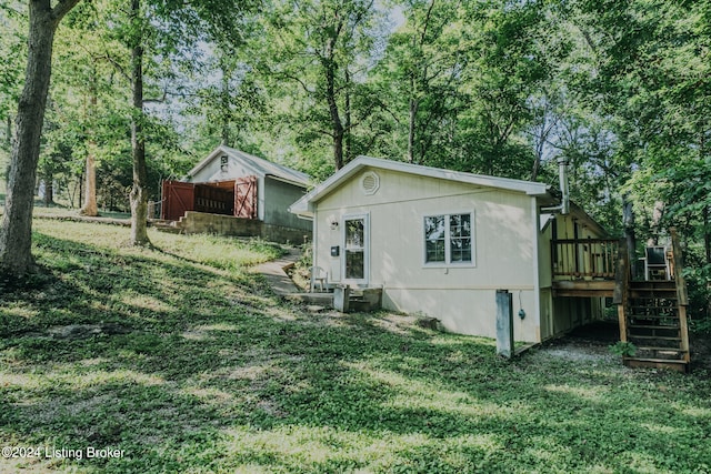 3085 Centerview Rough River Ln, Hudson, KY 40145 - rear view of property featuring stairs, a wooden deck, a yard, and view of wooded area