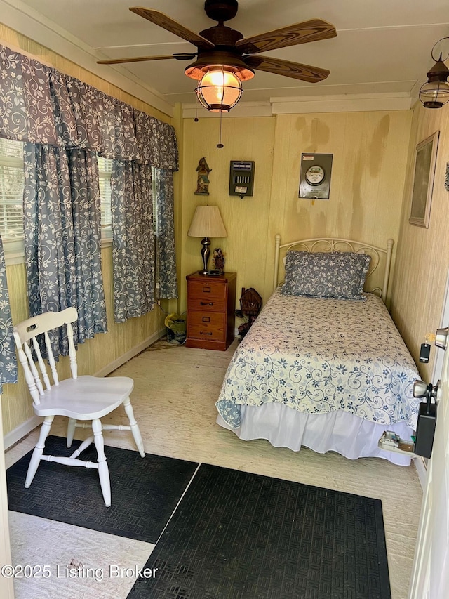 3085 Centerview Rough River Ln, Hudson, KY 40145 - carpeted bedroom featuring ornamental molding, a ceiling fan, and wooden walls