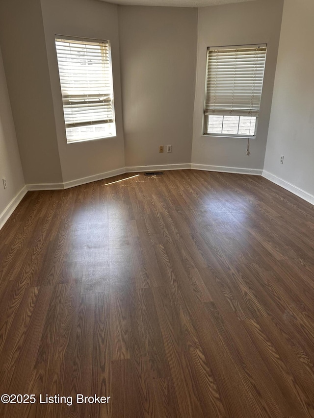 2325 Bolling Ave, Louisville, KY 40210 - unfurnished room featuring dark wood finished floors and baseboards
