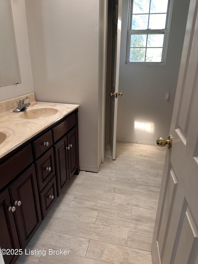2325 Bolling Ave, Louisville, KY 40210 - bathroom with double vanity and baseboards