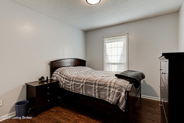 3904 Bayonne Ct, Jeffersontown, KY 40299 - bedroom featuring a textured ceiling, wood finished floors, and baseboards