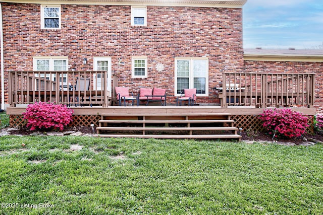 3904 Bayonne Ct, Jeffersontown, KY 40299 - rear view of property featuring a lawn, brick siding, and a wooden deck