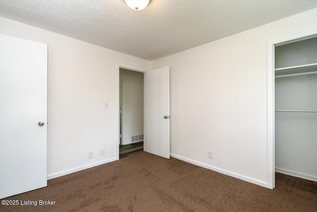 6100 Jessamine Ln, Louisville, KY 40258 - unfurnished bedroom featuring carpet floors, a closet, baseboards, and a textured ceiling