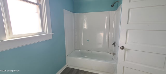 1033 Lynnhurst Ave, Louisville, KY 40215 - bathroom featuring baseboards, wood finished floors, and shower / bathtub combination