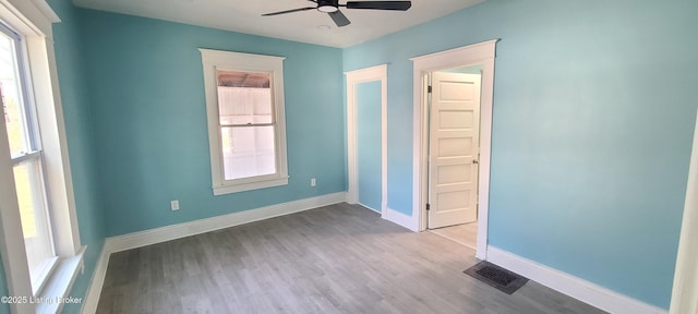 1033 Lynnhurst Ave, Louisville, KY 40215 - spare room featuring a ceiling fan, wood finished floors, and baseboards