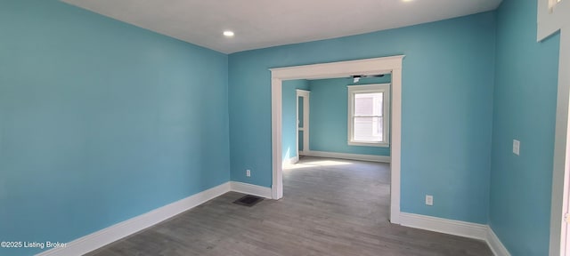1033 Lynnhurst Ave, Louisville, KY 40215 - spare room featuring baseboards, dark wood-type flooring, and recessed lighting