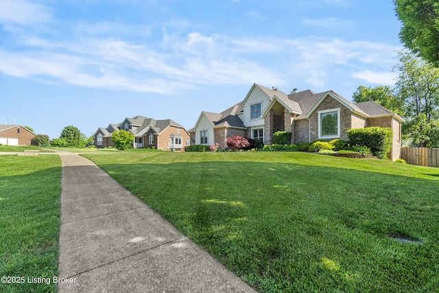 916 Winchester Blvd, Elizabethtown, KY 42701 - view of front of house with a residential view, stone siding, and a chimney