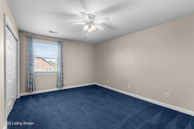 916 Winchester Blvd, Elizabethtown, KY 42701 - unfurnished room with dark carpet, ceiling fan, and baseboards