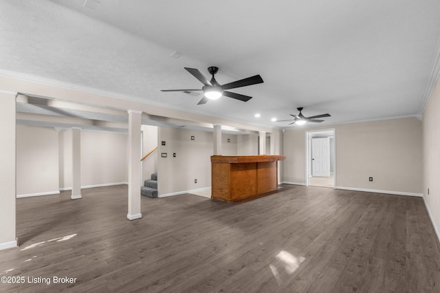 916 Winchester Blvd, Elizabethtown, KY 42701 - unfurnished living room with ornamental molding, a ceiling fan, dark wood-type flooring, baseboards, and stairway