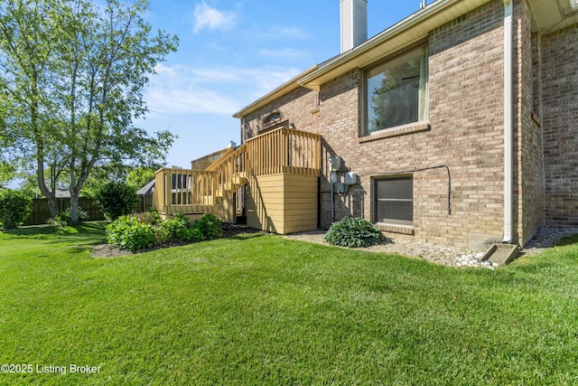 916 Winchester Blvd, Elizabethtown, KY 42701 - rear view of property featuring stairs, brick siding, a chimney, and a deck