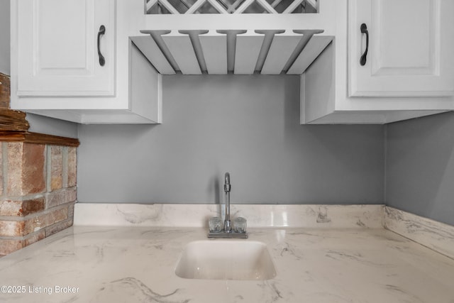 916 Winchester Blvd, Elizabethtown, KY 42701 - kitchen with a sink, white cabinetry, and light stone counters
