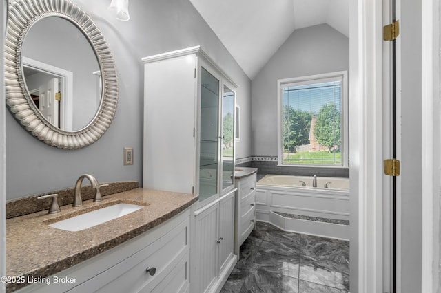 916 Winchester Blvd, Elizabethtown, KY 42701 - bathroom with marble look tiles, vanity, a bath, and lofted ceiling