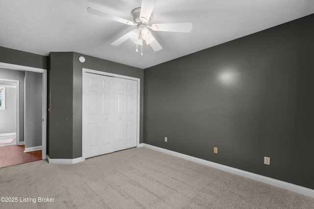 916 Winchester Blvd, Elizabethtown, KY 42701 - unfurnished bedroom with carpet, baseboards, a closet, and a ceiling fan