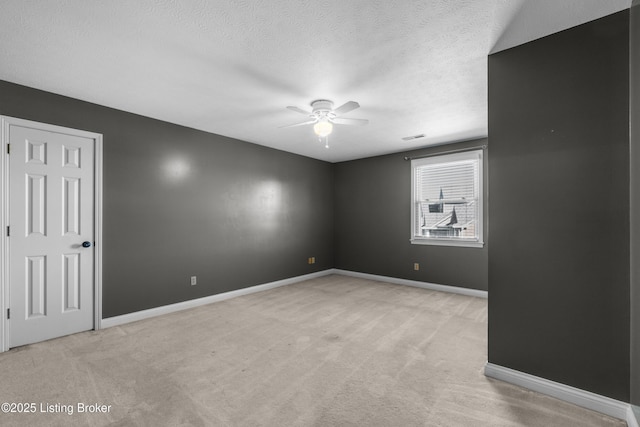 916 Winchester Blvd, Elizabethtown, KY 42701 - empty room featuring ceiling fan, light carpet, baseboards, and a textured ceiling