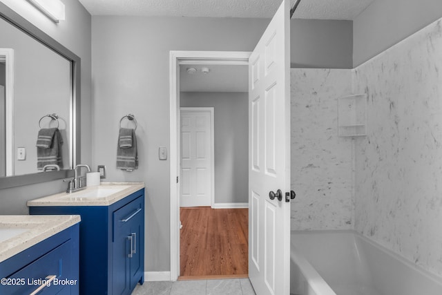916 Winchester Blvd, Elizabethtown, KY 42701 - bathroom with two vanities, tub / shower combination, and tile patterned floors