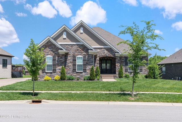 15905 Cabin View Ln, Louisville, KY 40245 - craftsman inspired home with stone siding, a front lawn, and french doors