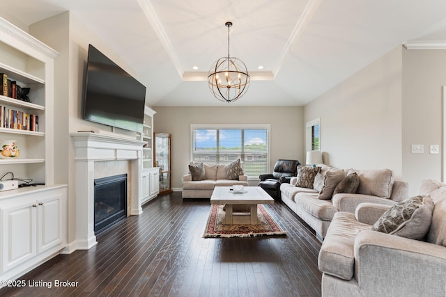 15905 Cabin View Ln, Louisville, KY 40245 - living room with a chandelier, dark wood-style floors, a tiled fireplace, a raised ceiling, and ornamental molding