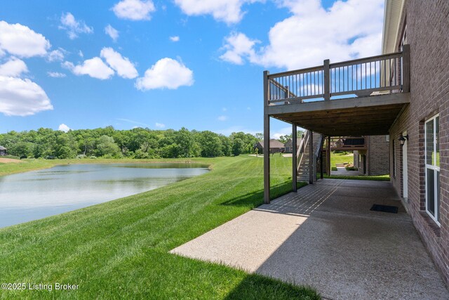 15905 Cabin View Ln, Louisville, KY 40245 - view of green lawn featuring stairway, a deck with water view, and a patio area