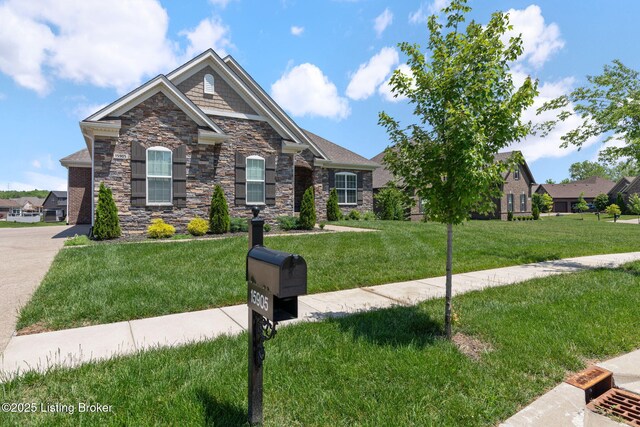 15905 Cabin View Ln, Louisville, KY 40245 - craftsman-style home with stone siding and a front lawn