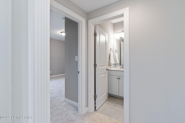 15905 Cabin View Ln, Louisville, KY 40245 - hall with a sink, light colored carpet, and baseboards