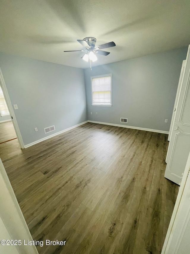 4302 Woodgate Ln, Louisville, KY 40220 - unfurnished bedroom with baseboards, wood finished floors, and ceiling fan