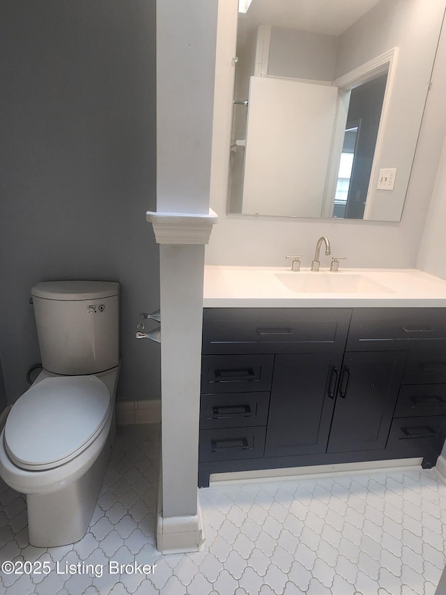 4302 Woodgate Ln, Louisville, KY 40220 - bathroom with tile patterned floors, toilet, and vanity