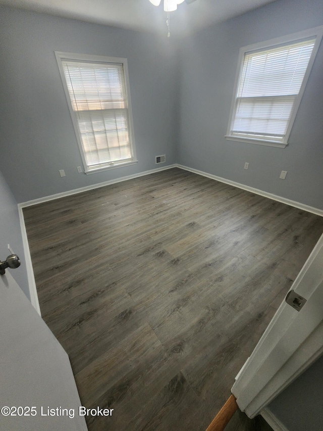 4302 Woodgate Ln, Louisville, KY 40220 - unfurnished room with healthy amount of natural light, dark wood-type flooring, baseboards, and a ceiling fan