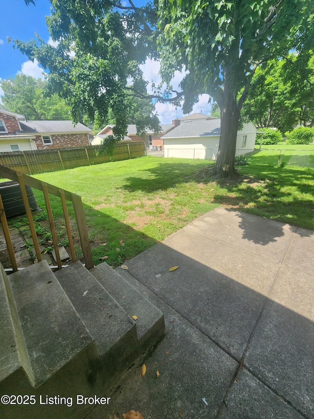 4302 Woodgate Ln, Louisville, KY 40220 - view of yard featuring a patio area and central AC unit