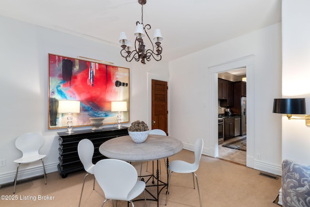1204 S 2nd St Unit 1, Louisville, KY 40203 - dining room featuring a chandelier, light colored carpet, and baseboards