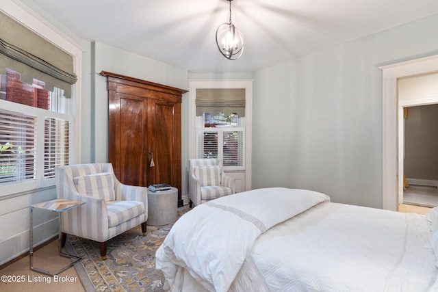 1204 S 2nd St Unit 1, Louisville, KY 40203 - bedroom featuring a chandelier