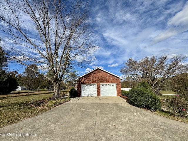 11569 New Haven Rd, New Haven, KY 40051 - view of side of property with brick siding, an outdoor structure, and driveway