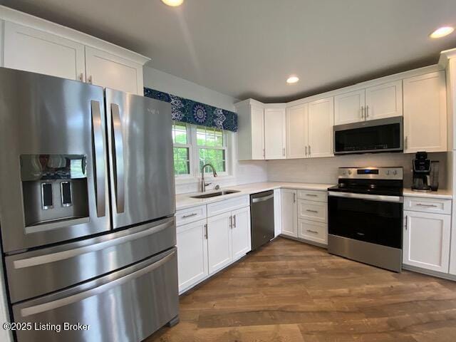 6780 Murrays Run Rd, Coxs Creek, KY 40013 - kitchen featuring appliances with stainless steel finishes, a sink, light countertops, white cabinetry, and recessed lighting