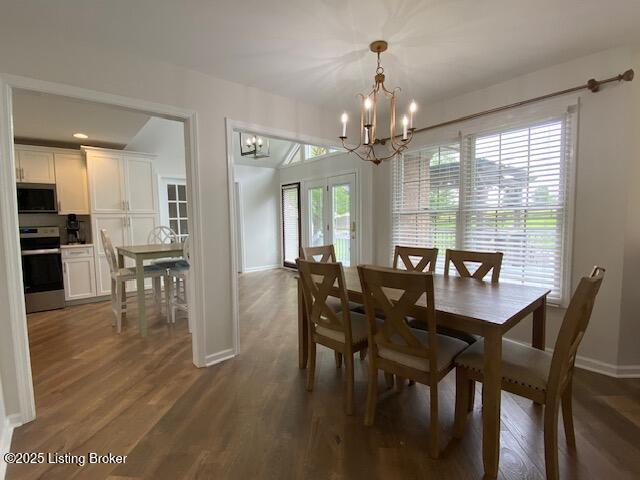 6780 Murrays Run Rd, Coxs Creek, KY 40013 - dining area with a chandelier, baseboards, and dark wood-type flooring