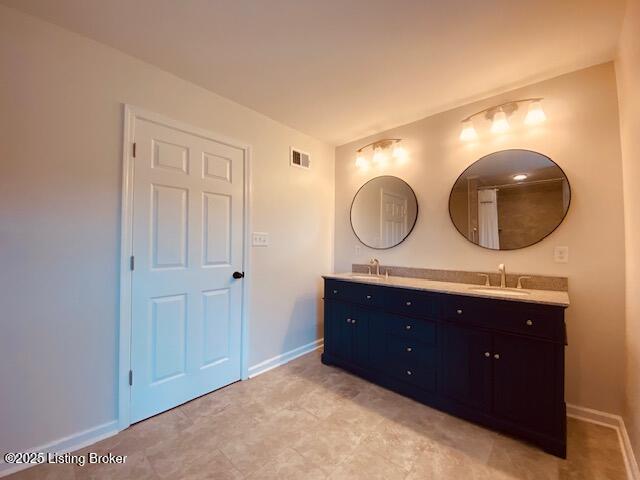 6780 Murrays Run Rd, Coxs Creek, KY 40013 - bathroom with baseboards and double vanity