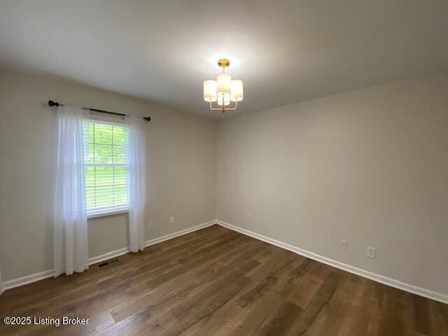 6780 Murrays Run Rd, Coxs Creek, KY 40013 - unfurnished room with a chandelier, dark wood-type flooring, and baseboards