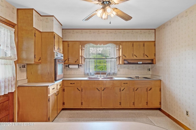 2200 Anneta Rd, Leitchfield, KY 42754 - kitchen with a sink, wall oven, wallpapered walls, a ceiling fan, and light countertops