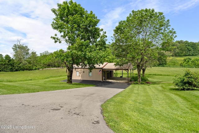 2200 Anneta Rd, Leitchfield, KY 42754 - view of front of property featuring asphalt driveway, a front lawn, a carport, and metal roof