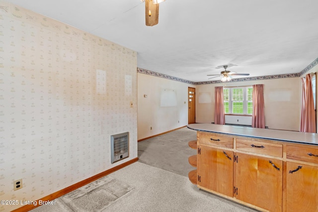 2200 Anneta Rd, Leitchfield, KY 42754 - kitchen featuring a ceiling fan, heating unit, baseboards, light colored carpet, and wallpapered walls