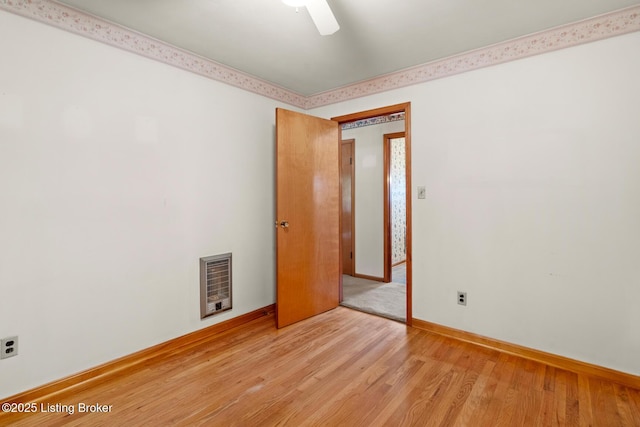 2200 Anneta Rd, Leitchfield, KY 42754 - unfurnished room with light wood finished floors, heating unit, baseboards, and a ceiling fan