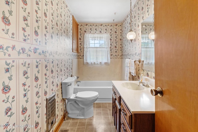 2200 Anneta Rd, Leitchfield, KY 42754 - full bath featuring wallpapered walls, toilet, vanity, a tub to relax in, and heating unit