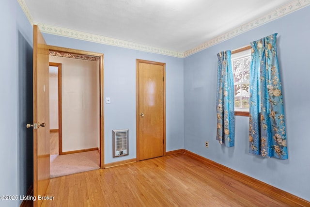 2200 Anneta Rd, Leitchfield, KY 42754 - unfurnished bedroom featuring light wood-type flooring, heating unit, baseboards, and a closet