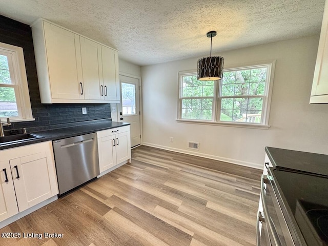 4813 Fox Chase Dr, Shepherdsville, KY 40165 - kitchen with stainless steel appliances, a sink, dark countertops, white cabinets, and light wood finished floors