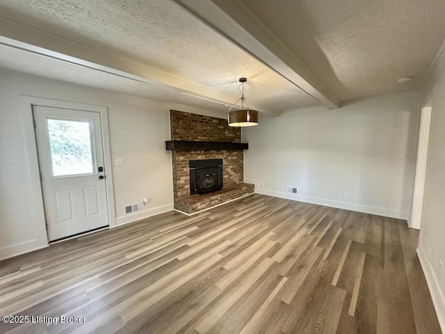 4813 Fox Chase Dr, Shepherdsville, KY 40165 - unfurnished living room with a textured ceiling, wood finished floors, baseboards, and beamed ceiling