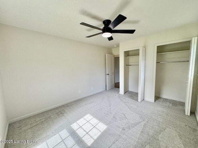 4813 Fox Chase Dr, Shepherdsville, KY 40165 - unfurnished bedroom featuring light carpet, two closets, baseboards, and a textured ceiling