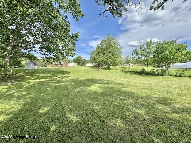 4813 Fox Chase Dr, Shepherdsville, KY 40165 - view of grassy yard featuring a storage unit and an outdoor structure