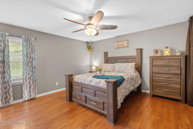 4211 Machupe Dr, Louisville, KY 40241 - bedroom with wood finished floors, baseboards, and a ceiling fan