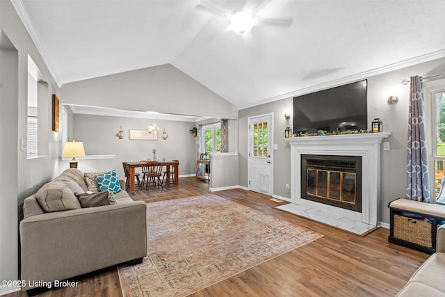 4211 Machupe Dr, Louisville, KY 40241 - living area with a ceiling fan, vaulted ceiling, ornamental molding, a fireplace with flush hearth, and wood finished floors