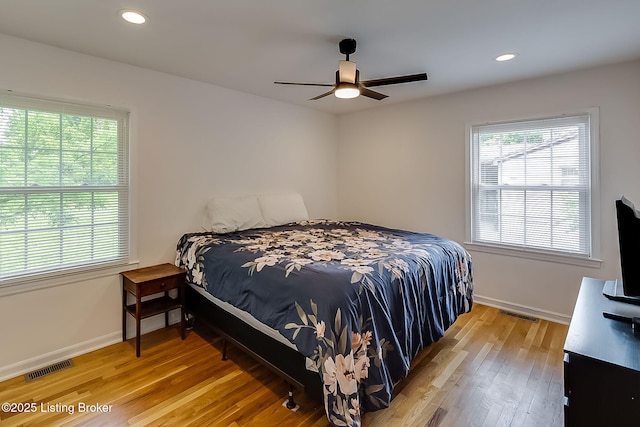 bedroom with light wood-style flooring, baseboards, recessed lighting, and ceiling fan